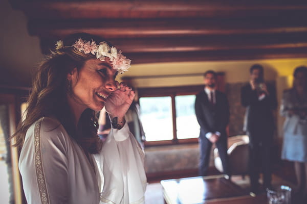 Bride wiping away tear