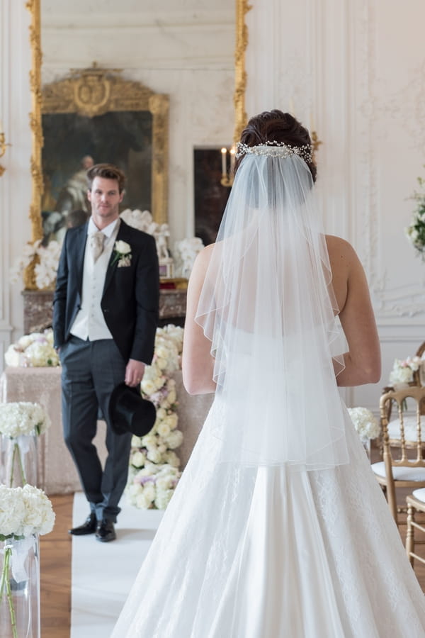 Bride and groom facing each other