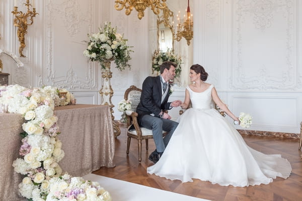 Bride and groom sitting