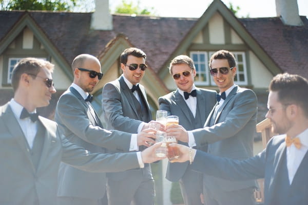 Groomsmen raising toast