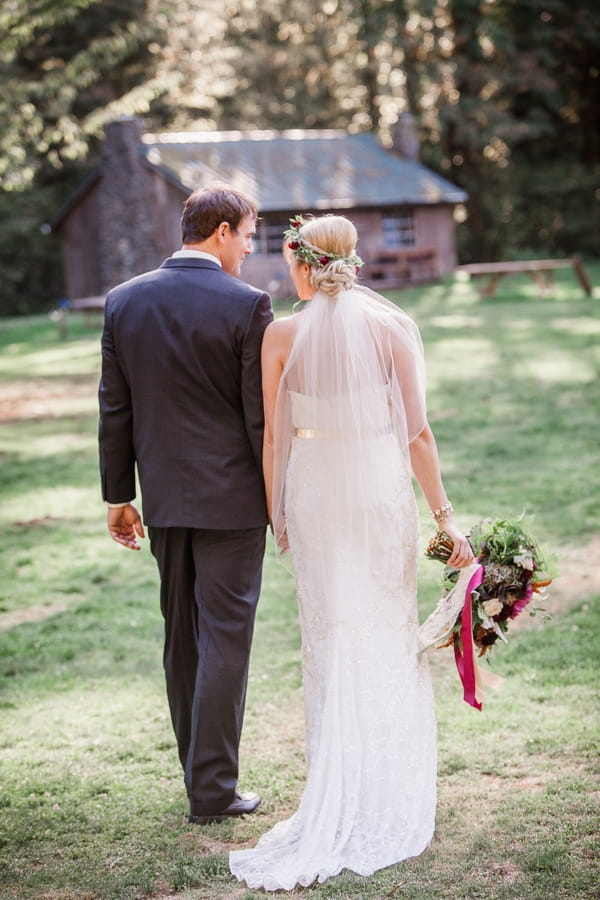 Bride and groom holding hands and walking