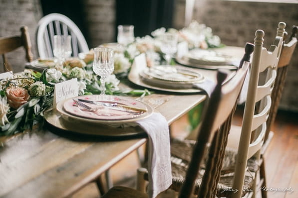 Place settings on rustic wedding table
