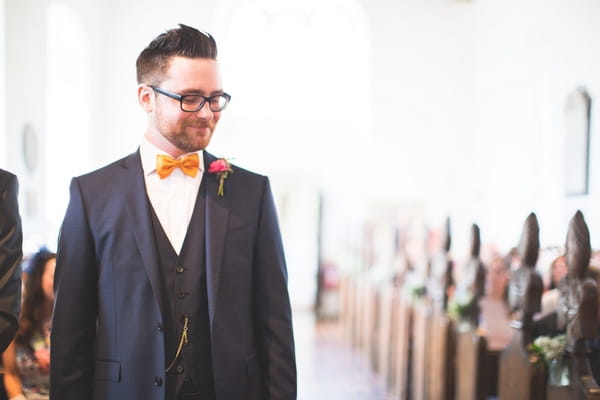 Groom waiting at altar