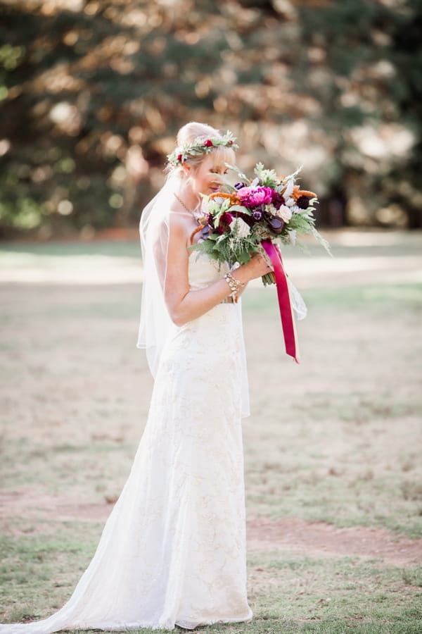 Bride smelling bouquet