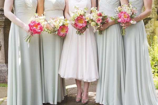 Bride and bridesmaids holding bouquets