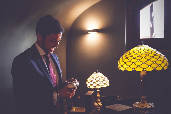 Groom looking at new watch