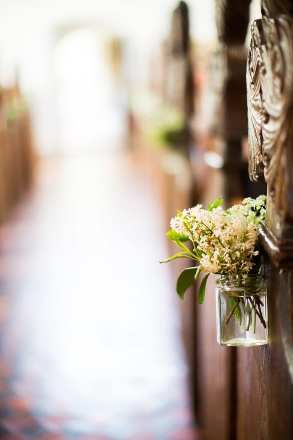 Jar of flowers hanging in church