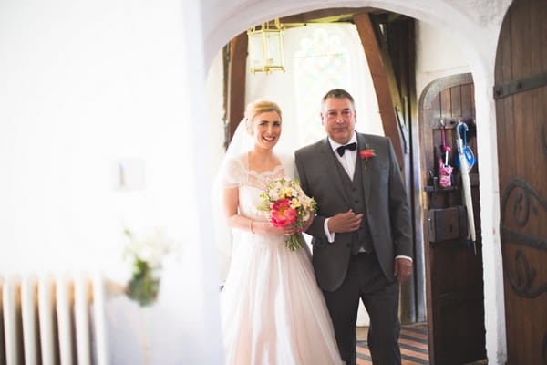 Bride and father entering church