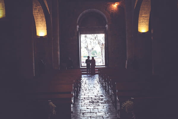 Groom walking with mother into church