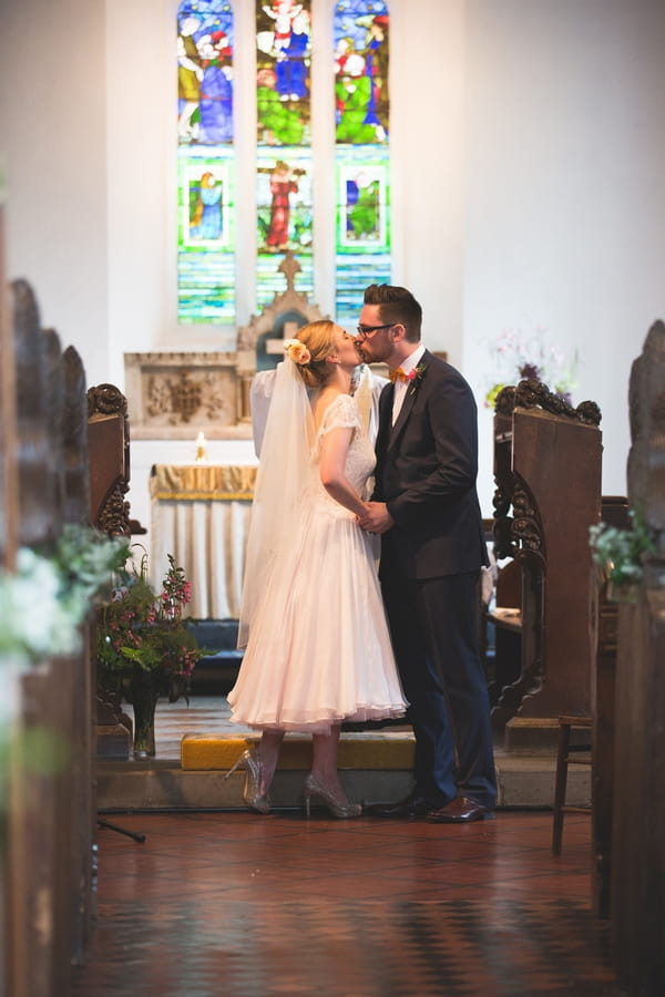 Bride and groom kiss