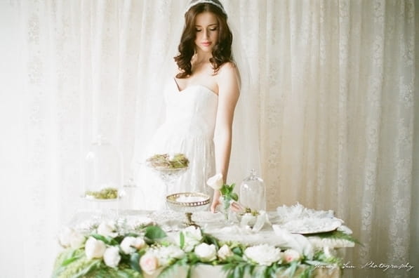 Bride standing at table
