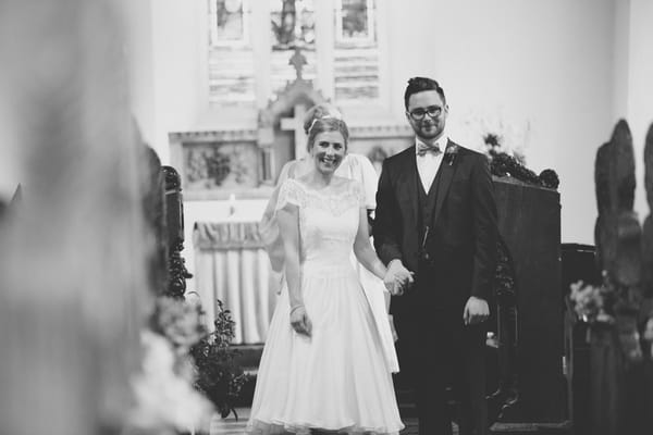 Newly married bride and groom smiling