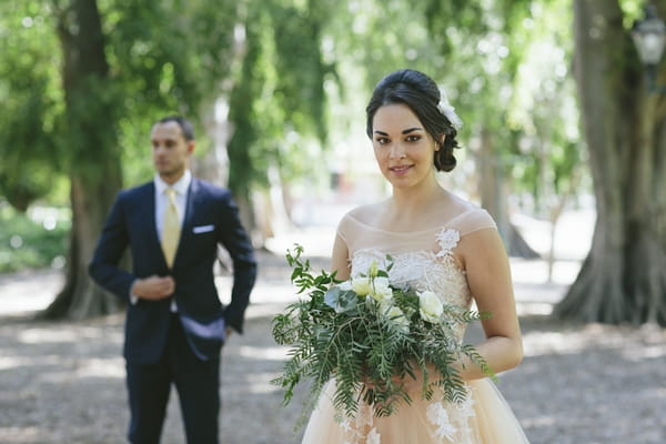 Bride with groom in background