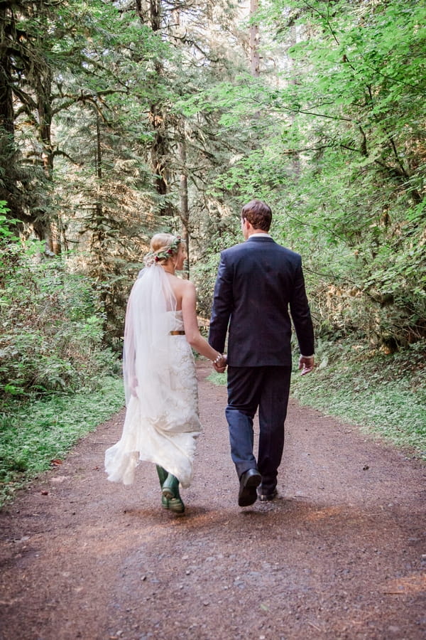 Bride and groom walking holding hands