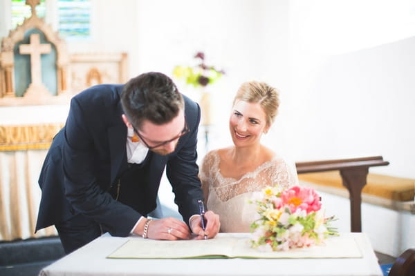 Groom signing register