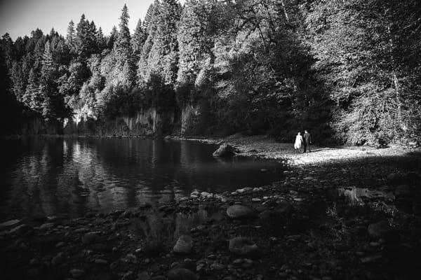 Bride and groom on other side of lake