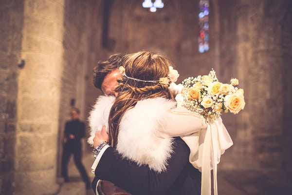 Bride and groom hugging