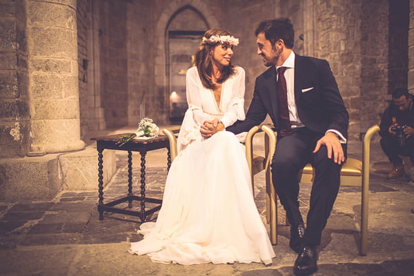 Bride and groom sitting in church