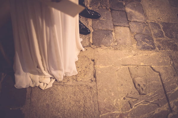 Skull in stone on church floor