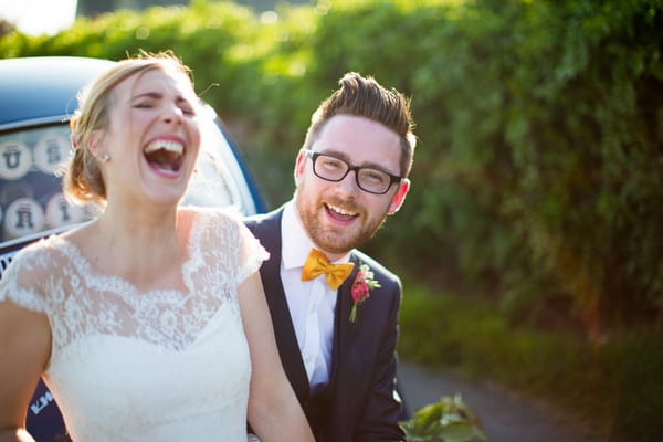 Bride and groom laughing