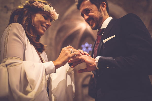 Bride and groom exchanging rings