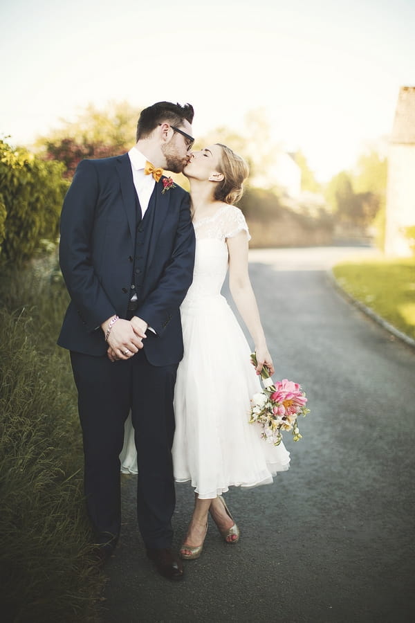 Bride and groom kissing