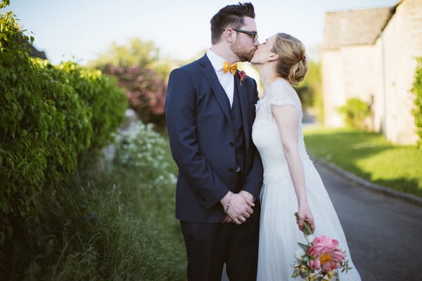 Bride and groom kiss