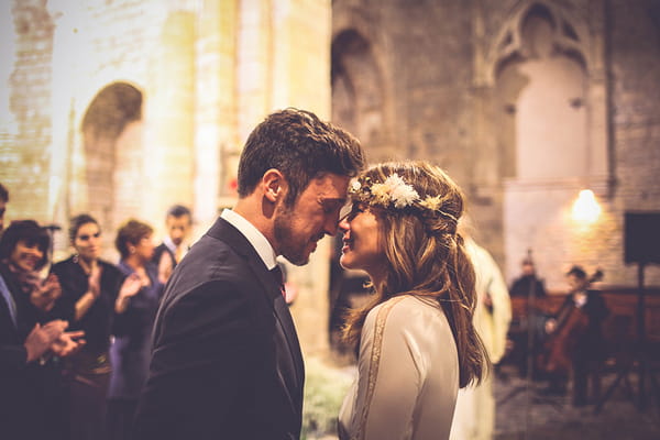 Bride and groom touching noses