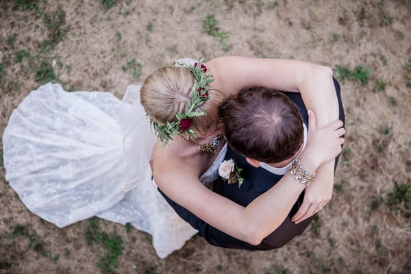 Picture taken above bride and groom kissing