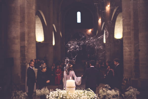 Bride and groom walking away from altar