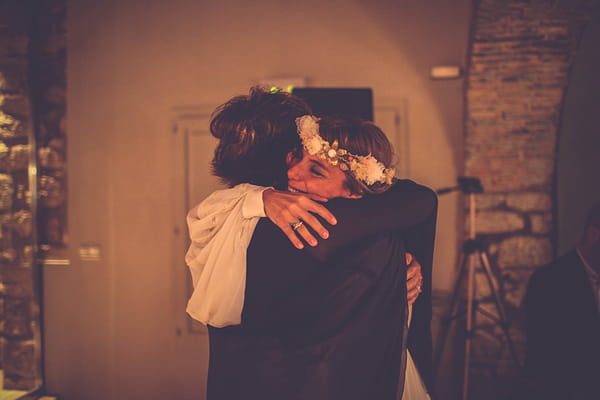 Bride hugging friend