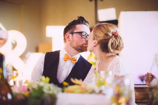 Bride and groom kiss