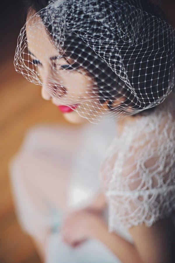 Bride wearing birdcage veil