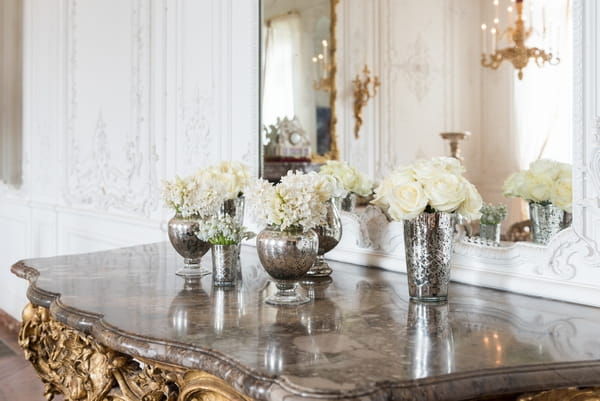 Wedding flowers in silver vases