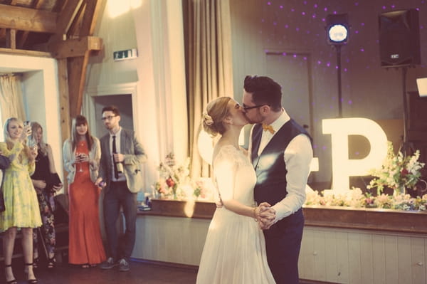 Bride and groom kissing