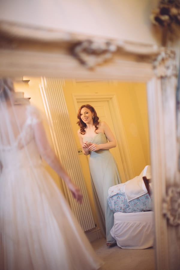 Bridesmaid reflected in mirror