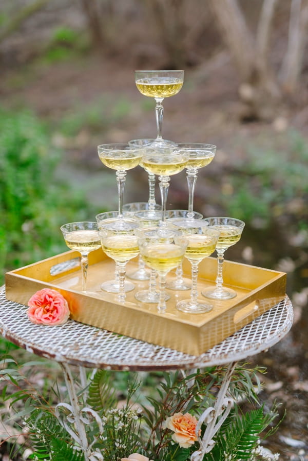 Tower of champagne glasses on tray