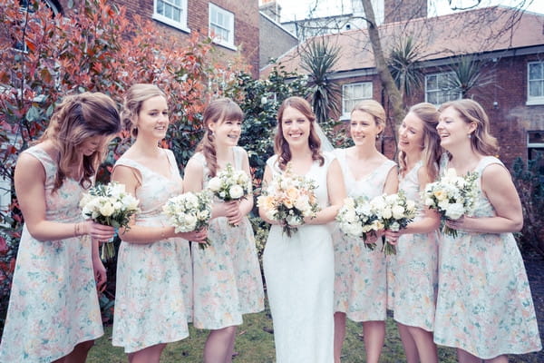 Bride and bridesmaids in floral dresses