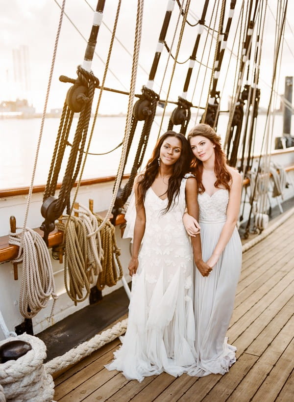 Two brides on deck of the Tall Ship Elissa