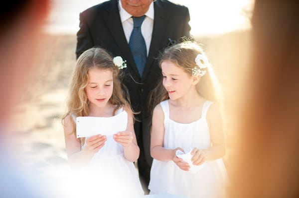 Young twin girls doing reading at vow renewal