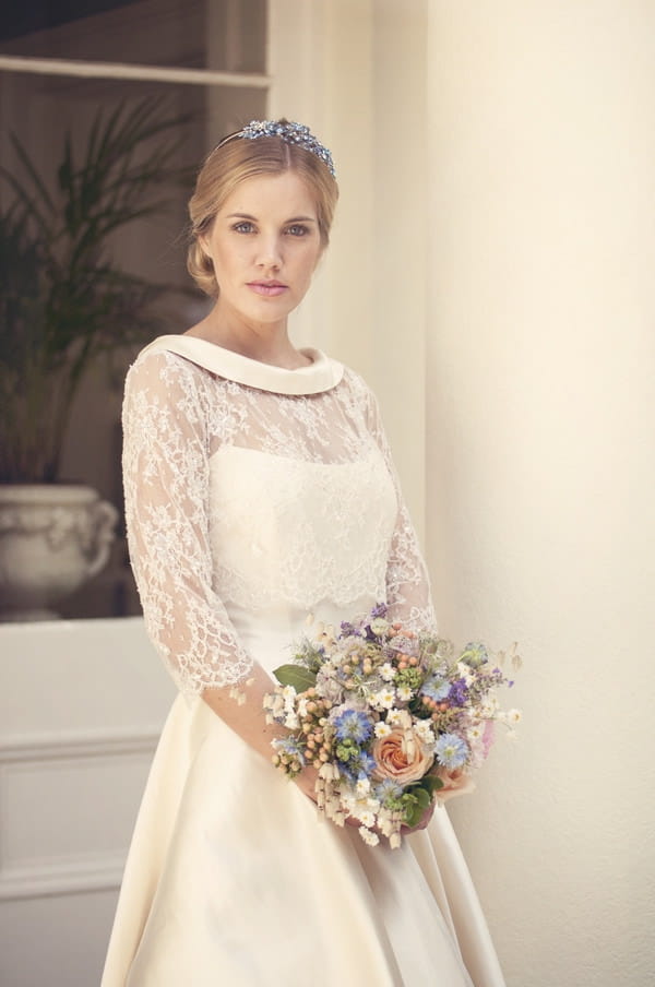 Bride wearing tea length dress with lace detail