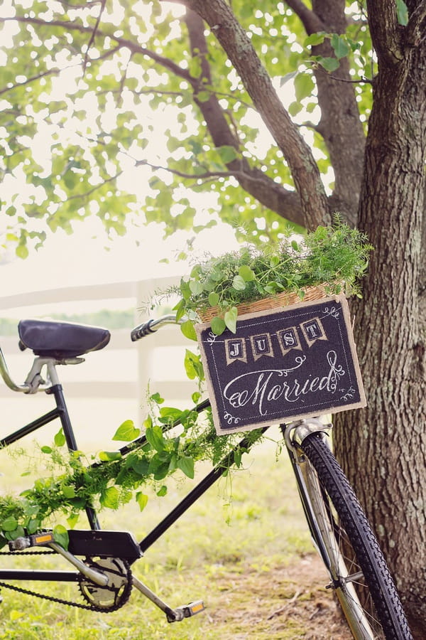 Just married sign on front of vintage tandem bicycle