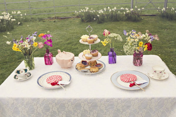 Table with cakes and lollipops