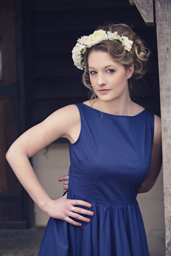 Bride wearing blue wedding dress and white flower crown