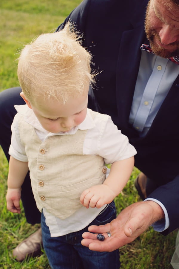 Groom giving pageboy blueberry