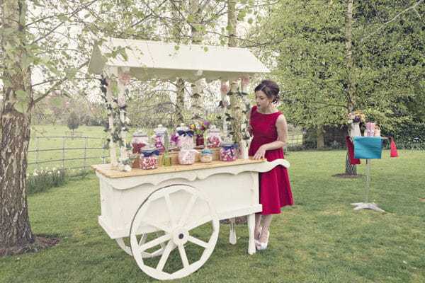 Bride at vintage carnival sweet cart