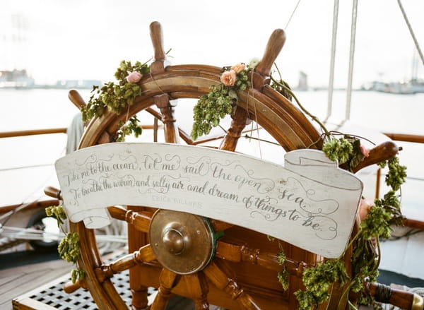 Wheel of the Tall Ship Elissa with flowers