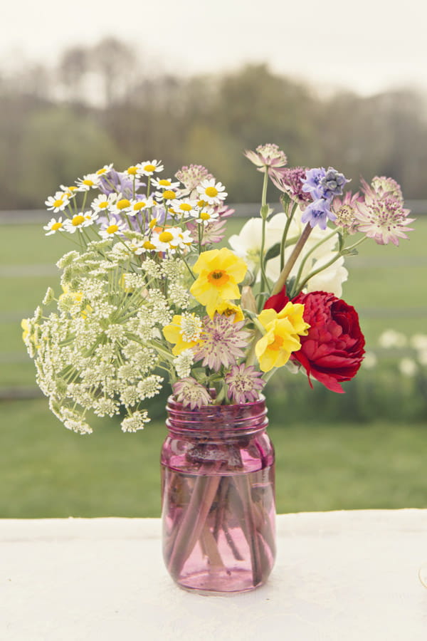 Wedding flowers in pink glass vase