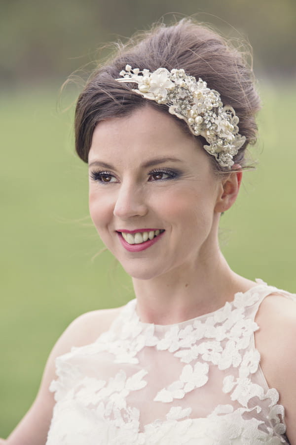 Bride with lace headpiece and detail on dress