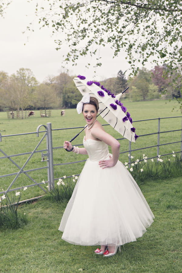 Bride holding parasol